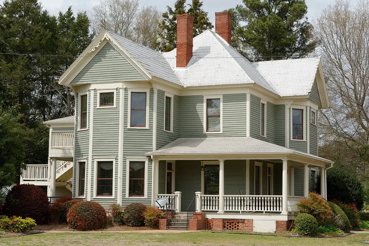 Queen Anne-style house in the Locust Grove Historic District, the older part of a town where french drains and drainage needs vary lot by lot